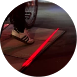 Red ground laser projecting beside a bicycle